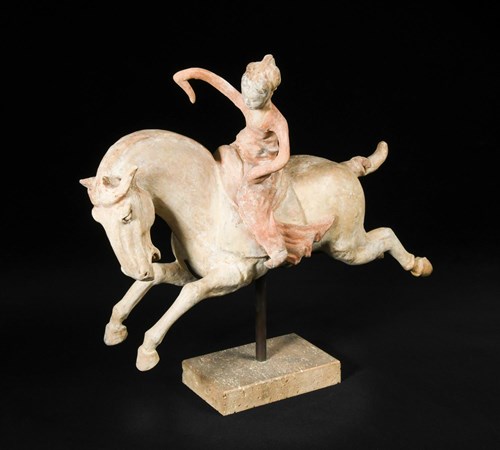 Lot 34 - A red painted Tang dynasty pottery female polo player