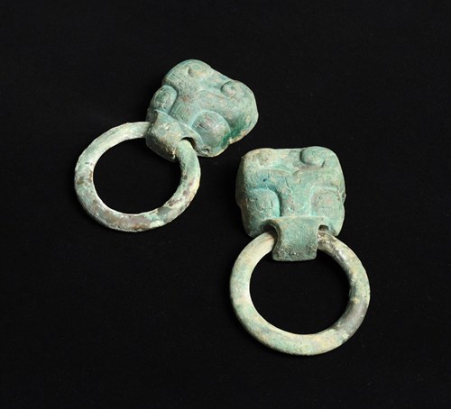 Lot 2 - A large pair of bronze 'Taotie' masks, Western Zhou dynasty