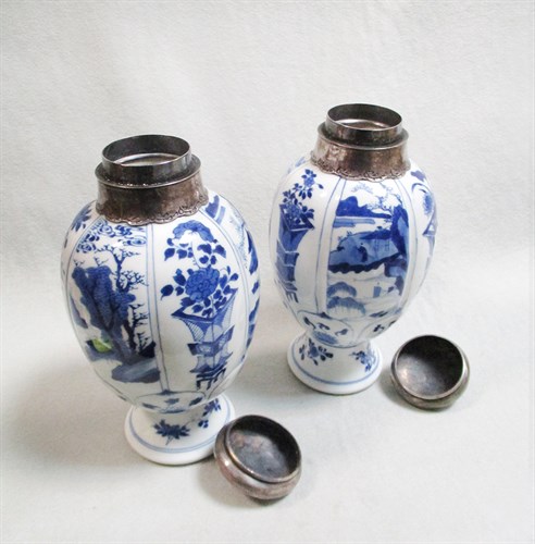 Lot 153 - A pair of Kangxi lobed ovoid blue and white vases