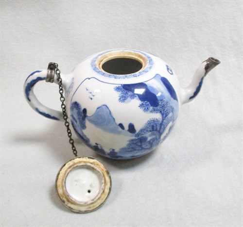 Lot 159 - A Kangxi silver mounted blue and white tea pot and cover