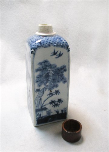 Lot 129 - A transitional or early Kangxi square sectioned bottle and a wooden cover
