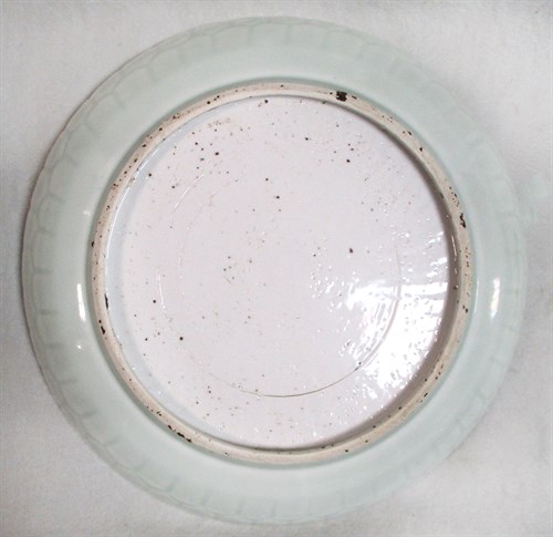 Lot 62 - A Ming pale celadon dish
