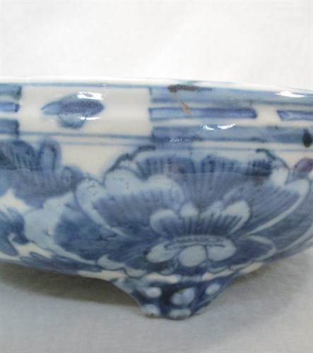 Lot 168 - A Kangxi tripod censer with peonies