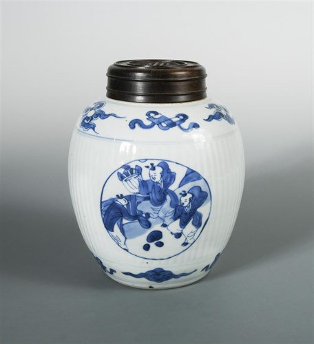 Lot 185 - A Kangxi ribbed spherical jar and wood cover