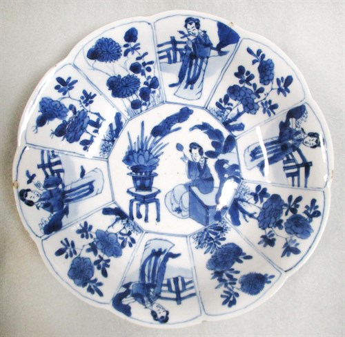 Lot 199 - A Kangxi dish painted with a lady and flowers