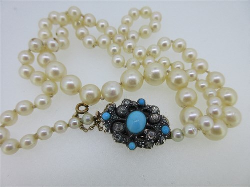 Lot 162 - A cultured pearl necklace with antique diamond and turquoise clasp
