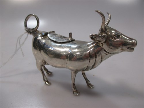 Lot 425 - A continental metalwares cow creamer