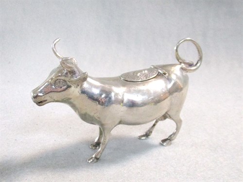 Lot 299 - A continental metalwares semi-naturalistic cow creamer
