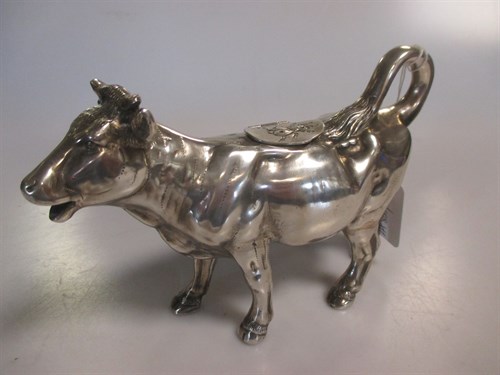 Lot 297 - A German metalwares silver naturalistic cow creamer