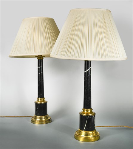Lot 197 - A pair of black marble and brass mounted columnar table Lamps
