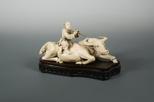 Lot 128 - A fine ivory okimono of a boy upon a buffalo, Meiji period