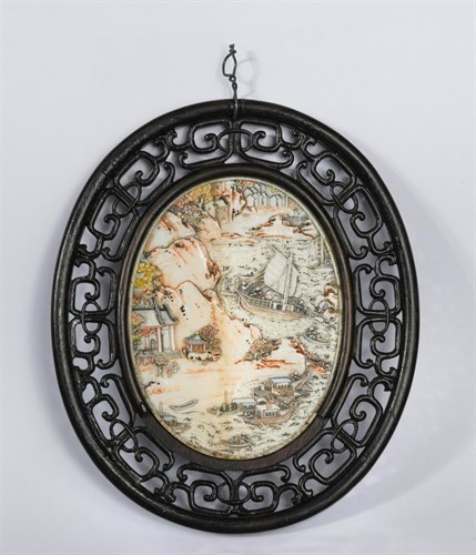 Lot 104 - A Chinese carved ivory oval tablet, Qing Dynasty, late 18th/early19th century