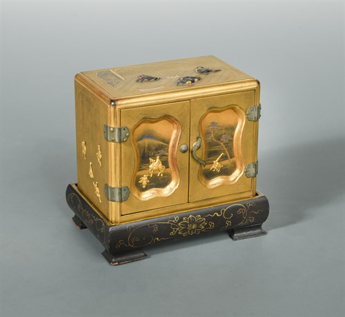 Lot 102 - A Japanese miniature two doored, lacquer table cabinet (kodansu), Taisho/Showa Period