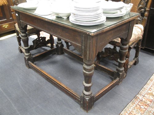 Lot 453 - An oak refectory table, on stretchered turned...