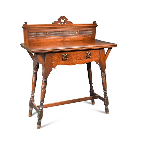 Lot 674 - An Arts and Crafts walnut side table, the...