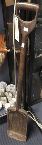 Lot 150 - A wooden shovel and a bell
