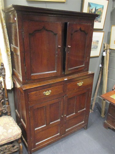 Lot 676 - An 18th century oak cupboard, the recessed...