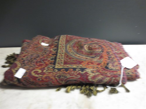 Lot 134 - A large wool Jamawar shawl in shades of rusts...