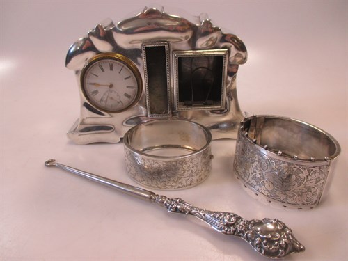 Lot 284 - Two half engraved cuff bangles, a silver...