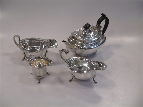 Lot 311 - A silver batchelor's teapot, two silver sauce...