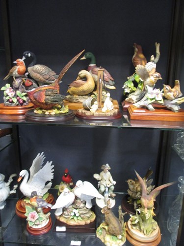 Lot 142 - A quantity of porcelain and composite birds -...