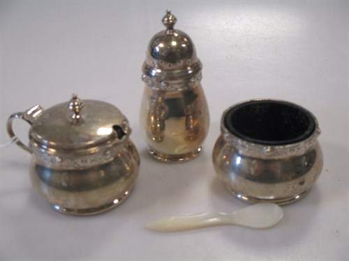 Lot 288 - A silver three piece condiment set with mother...