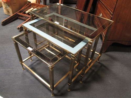 Lot 478 - Three graduated brass framed occasional tables...