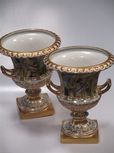 Lot 176 - A pair of gilt two handled pots 33cm high