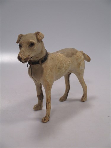 Lot 101 - A Pony skin figure of a dog
