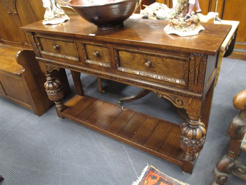Lot 460 - An oak dresser in the Tudor style 84cm 130cm 36cm