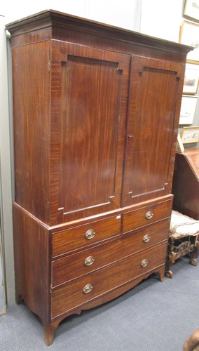 Lot 491 - A Regency mahogany linen press, on swept...