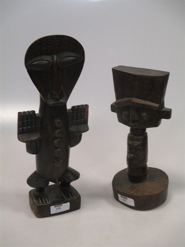 Lot 108 - An African carved hardwood deity with flat top...