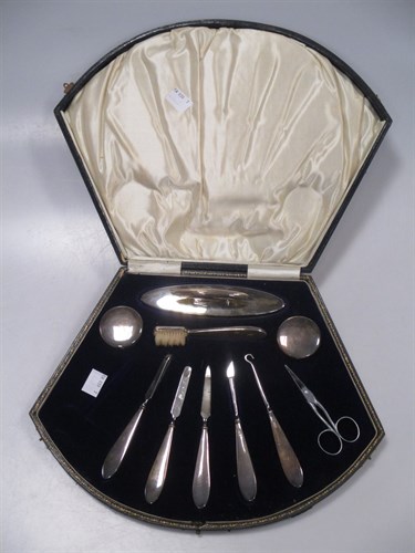 Lot 303 - A cased silver manicure set (lacking one pair...