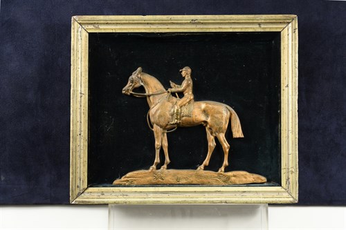 Lot 435A - A gilded cast metal relief of a racehorse and...