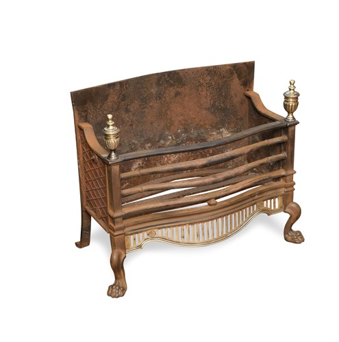 Lot 680 - A small George III style iron and brass fire grate