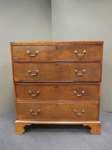 Lot 694 - A George III mahogany chest of drawers in two...
