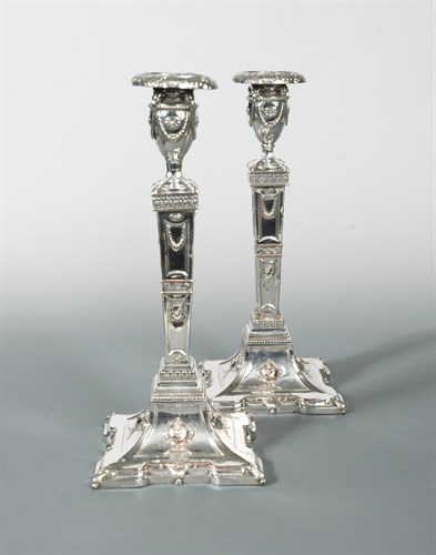 Lot 287 - A pair of silver plated column candlesticks