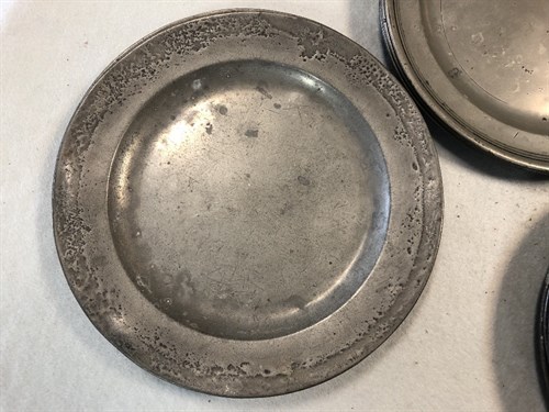 Lot 388 - A set of four 18th century pewter plates