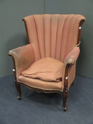 Lot 560 - A fan backed mahogany wing armchair, on...