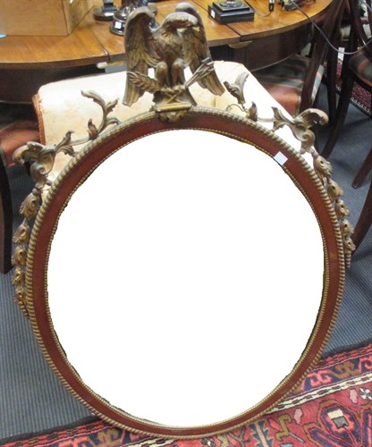 Lot 681 - A mahogany and parcel gilt oval wall mirror,...