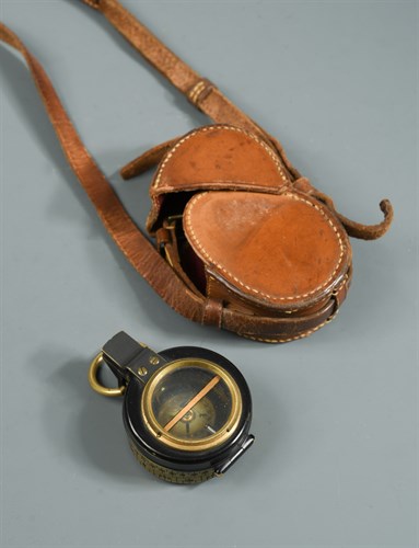 Lot 373 - A Barker's Patent brass and black enamel prismatic compass, dated 1910