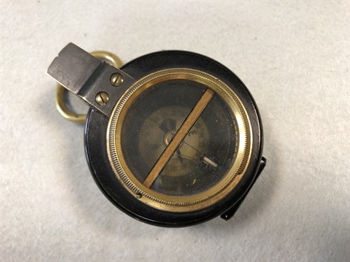 Lot 373 - A Barker's Patent brass and black enamel prismatic compass, dated 1910