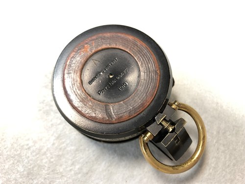 Lot 373 - A Barker's Patent brass and black enamel prismatic compass, dated 1910