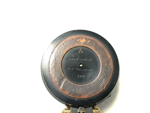 Lot 373 - A Barker's Patent brass and black enamel prismatic compass, dated 1910