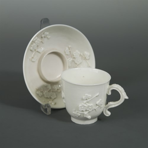 Lot 21 - A Saint-Cloud blanc de chine trembleuse cup and saucer, circa 1720-40