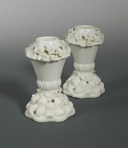 Lot 23 - A rare pair of Saint-Cloud blanc de chine pot-pourri vases, circa 1730-50