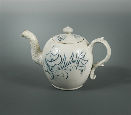 Lot 32 - An 18th century Staffordshire salt-glazed miniature teapot and cover