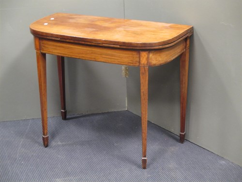 Lot 619 - A George III mahogany foldover top table