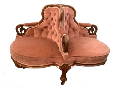 Lot 47 - A mid-Victorian walnut framed conversation seat, circa 1870