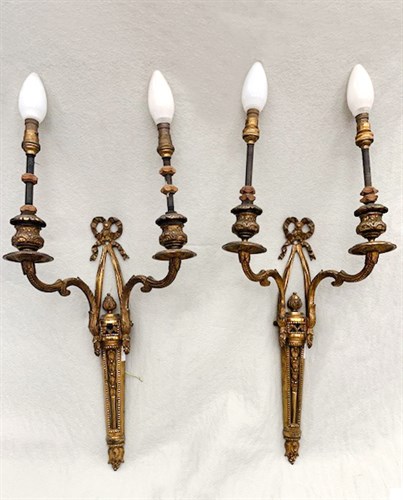Lot 11 - A pair of gilt brass French style two branch wall lights